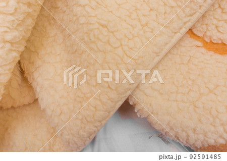 Yellow sheep material wool fur soft structure fleece fabric background texture warm natural nature skin Yellow sheep material wool fur soft structure fleece fabric background texture warm natural nature skin 92591485