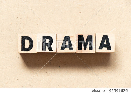 Alphabet letter block in word drama on wood background Alphabet letter block in word drama on wood background 92591626