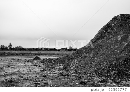 stockpiled topsoil at a residential development construction site. 92592777