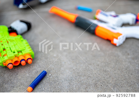 Soft foam dart gun loaded and ready for use by children. Soft foam dart gun loaded and ready for use by children. 92592788