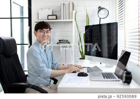 Professional development programmers are sit on a desk with work equipment such as: computer-laptop-tablet. for working in programming or writing code on  website,  HTML, javascript, Software. 92593089