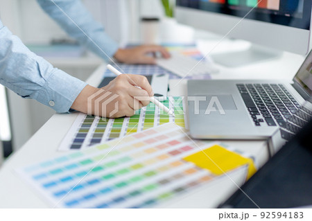 Professional development programmers are choosing color schemes to decorate their website or application to be attractive, Write information or code for the website,  HTML, Javascript, Color tone. 92594183