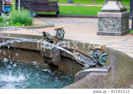Elements of a beautiful graceful city fountain in the form of fish. Elements of a beautiful graceful city fountain in the form of fish. 92595212