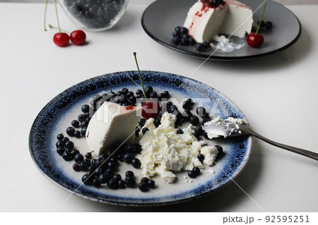 Dessert with seasonal blueberry berries. Cottage cheese with blueberries. Seasonal dessert summer vitamins proper nutrition . Homemade cottage cheese dishes. Protein 92595251