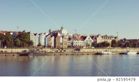Szczecin waterfront with clear blue sky at dawn, retro color toning applied, Poland. 92595479