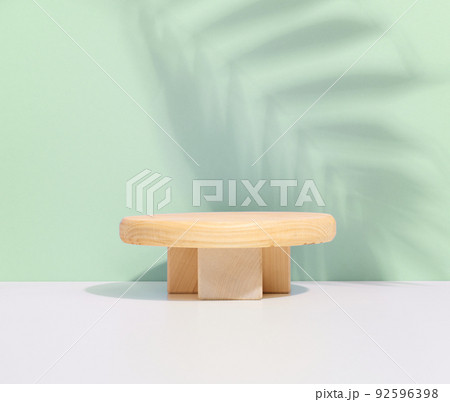 Stage for displaying products, cosmetics with a round wooden podium 92596398