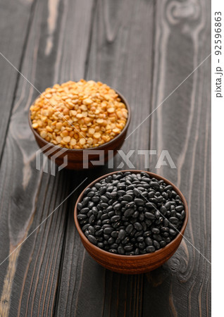 Fresh organic natural beans and peas on wooden rustic black background Fresh organic natural beans and peas on wooden rustic black background 92596863