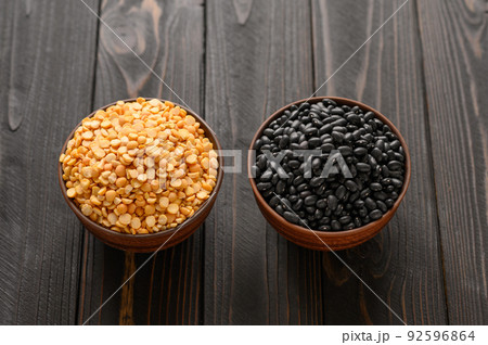 Fresh organic natural beans and peas on wooden rustic black background Fresh organic natural beans and peas on wooden rustic black background 92596864