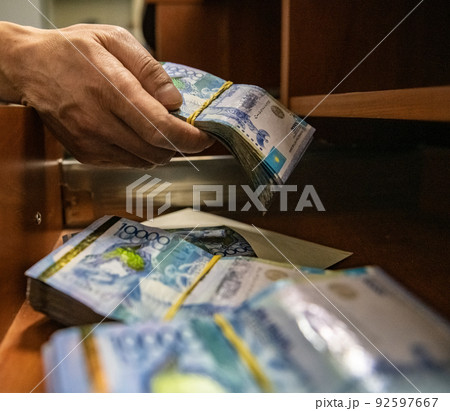 Thick wad of money cash on table. High quality photo 92597667