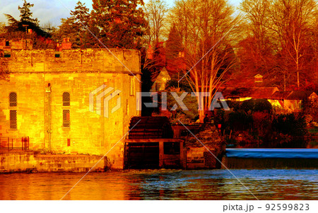 Ancient European medieval architectural building castle in golden autumn light with the blue sky background during autumn Ancient European medieval architectural building castle in golden autumn light with the blue sky background during autumn 92599823