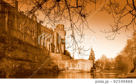 Ancient European medieval architectural building castle in golden autumn light with the blue sky background during autumn Ancient European medieval architectural building castle in golden autumn light with the blue sky background during autumn 92599888