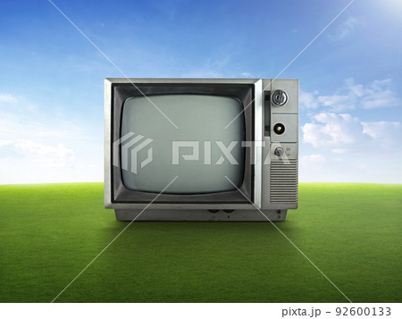 Vintage retro tv on grass Vintage retro tv on grass 92600133