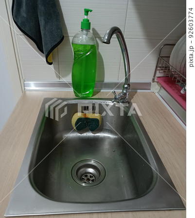 Sink with sponge and dishwashing liquid 92603774