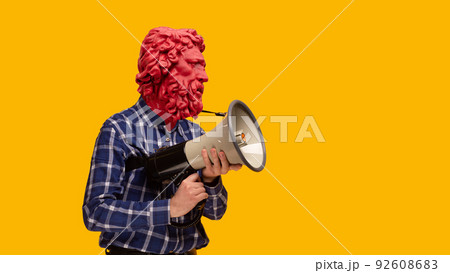 Abstract modern collage. The man with the plaster head of David with a megaphone on yellow background Abstract modern collage. The man with the plaster head of David with a megaphone on yellow background 92608683