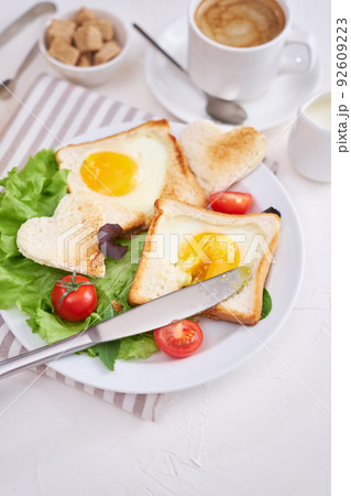 Fried Egg on Toast Bread and cup of fresh hot coffee on light grey background 92609223