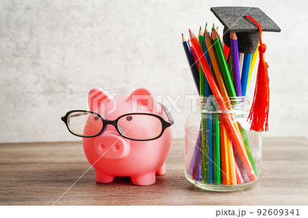 Graduation hat with colorful pencils on book with copy space, learning university education concept. Graduation hat with colorful pencils on book with copy space, learning university education concept. 92609341