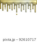 melted gold dripping on white background 92610717