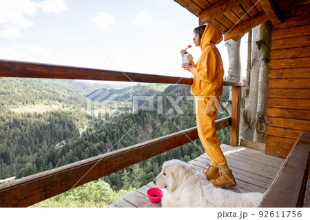 Woman eats freeze-dried food for hiking while traveling in mountains 92611756