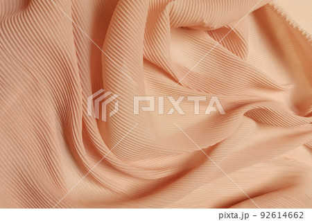 Orange chiffon fabric crumpled or wavy fabric texture background. Abstract linen cloth soft waves. Silk yarn. Smooth elegant luxury cloth texture. Concept for banner or advertisement. Orange chiffon fabric crumpled or wavy fabric texture background. Abstract linen cloth soft waves. Silk yarn. Smooth elegant luxury cloth texture. Concept for banner or advertisement. 92614662