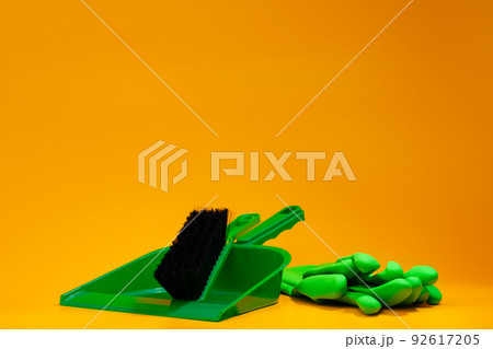 Home cleaning tools on yellow studio background Home cleaning tools on yellow studio background 92617205