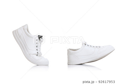 Casual, white gumshoes, sneakers with black design element isolated over white studio background 92617953