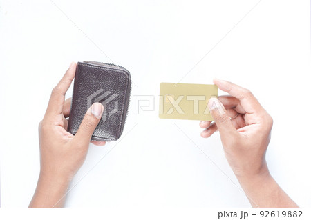top view of person hand holding credit card on white background top view of person hand holding credit card on white background 92619882