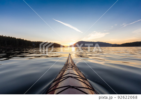 Sea Kayak paddling in the Pacific Ocean. Colorful Sunset Sky. Sea Kayak paddling in the Pacific Ocean. Colorful Sunset Sky. 92622068