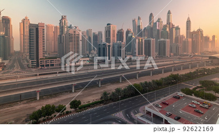 Dubai marina tallest block of skyscrapers morning timelapse. 92622169