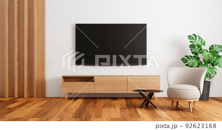 TV above wooden cabinet in modern empty room with plants carpet on wooden background. Japanese style theme. Architecture and interior concept. 3D illustration rendering 92623168