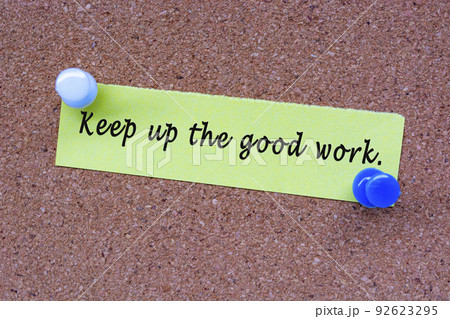Keep up he good work words on stick note and pinned to a cork notice board. 92623295
