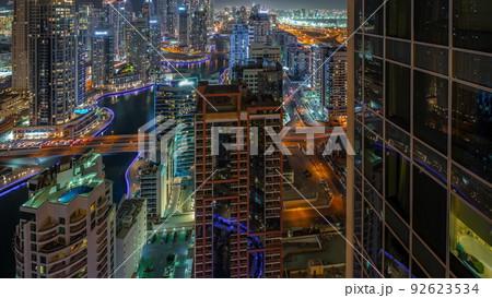 View of various skyscrapers in tallest recidential block in Dubai Marina aerial night timelapse View of various skyscrapers in tallest recidential block in Dubai Marina aerial night timelapse 92623534