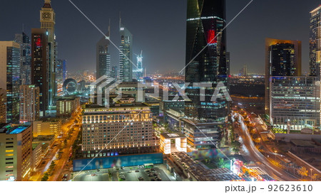 Aerial view of Dubai International Financial District with many skyscrapers night timelapse. 92623610