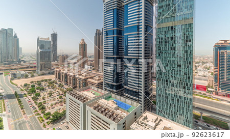 Aerial view of Dubai International Financial District with many skyscrapers all day timelapse. 92623617
