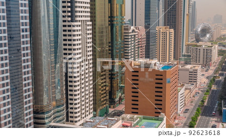 Aerial view of Dubai International Financial District with many skyscrapers timelapse. Aerial view of Dubai International Financial District with many skyscrapers timelapse. 92623618