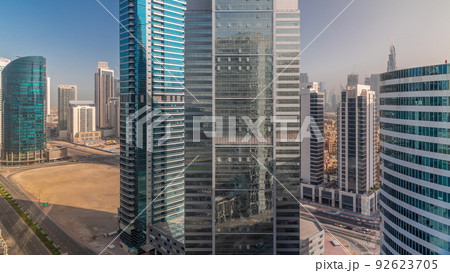 Cityscape skyscrapers of Dubai Business Bay with water canal aerial timelapse. 92623705