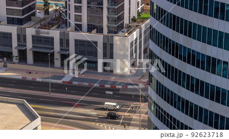 Dubai business bay district with office skyscrapers and traffic on the road intersection aerial timelapse. 92623718