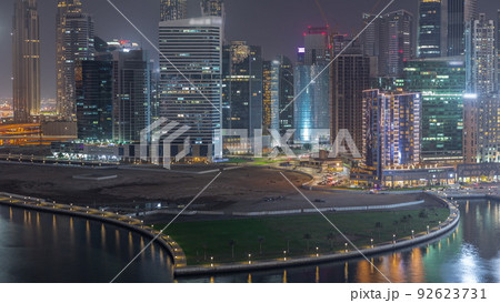 Cityscape of skyscrapers in Dubai Business Bay with water canal aerial night timelapse Cityscape of skyscrapers in Dubai Business Bay with water canal aerial night timelapse 92623731