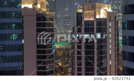 Skyscrapers in Dubai Business Bay and financial district aerial night timelapse. 92623742