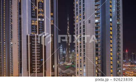 Tallest skyscrapers in downtown dubai located on bouleward street near shopping mall aerial night timelapse. 92623830
