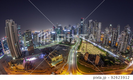 Panorama of Bay Avenue with modern towers residential development in Business Bay aerial all night timelapse, Dubai 92623912