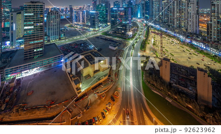 Water canal with modern towers residential development in Business Bay aerial panoramic night timelapse, Dubai Water canal with modern towers residential development in Business Bay aerial panoramic night timelapse, Dubai 92623962