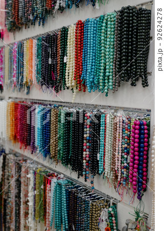 Shop window with necklaces and jewelry. Custome jewelry on display Shop window with necklaces and jewelry. Custome jewelry on display 92624278