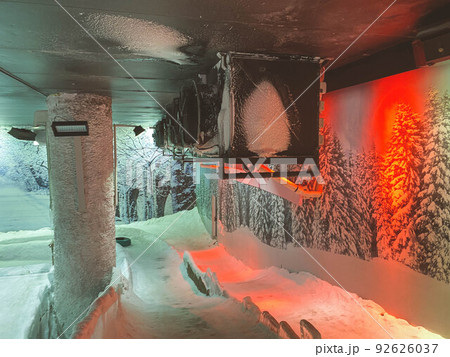 snow room. on the snow a hill for people to ride. entertainment in the snow room. extreme slides with ice, rapid descent down the hill with obstacles snow room. on the snow a hill for people to ride. entertainment in the snow room. extreme slides with ice, rapid descent down the hill with obstacles 92626037