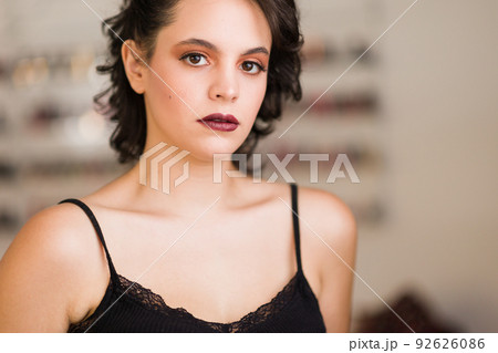 young hispanic woman in a beauty salon with makeup for skincare young hispanic woman in a beauty salon with makeup for skincare 92626086