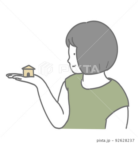 ミニチュアの家を見つめる女の子 92628237