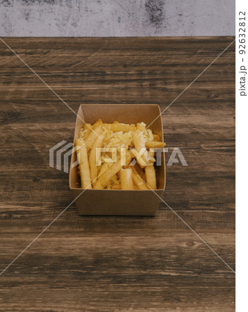Truffle fries with shaved truffle flakes in cardboard tray Truffle fries with shaved truffle flakes in cardboard tray 92632812