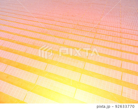 Aerial top view of a solar panels power plant. Photovoltaic solar panels at sunrise and sunset in countryside from above. Modern technology, climate care, earth saving, renewable energy concept. 92633770