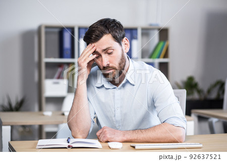 Close-up portrait of pensive man in office, businessman thinking over decision 92637521