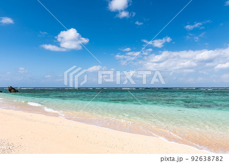 Incredible turquoise crystal clear sea water at a paradise beach in a sunny day. Incredible turquoise crystal clear sea water at a paradise beach in a sunny day. 92638782