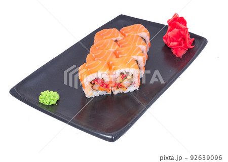 Japanese seafood Sushi roll isolated on white close up. Japanese food restaurant, sushi maki gunkan roll plate or platter set. Maki Sushi rolls with salmon and avocado. Sushi isolated at white 92639096